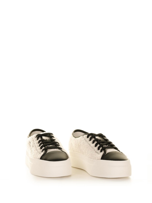 Fur sneakers with contrasting logo