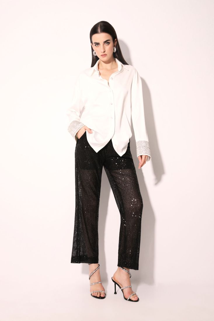 Pantaloni monocolour flare con paillettes